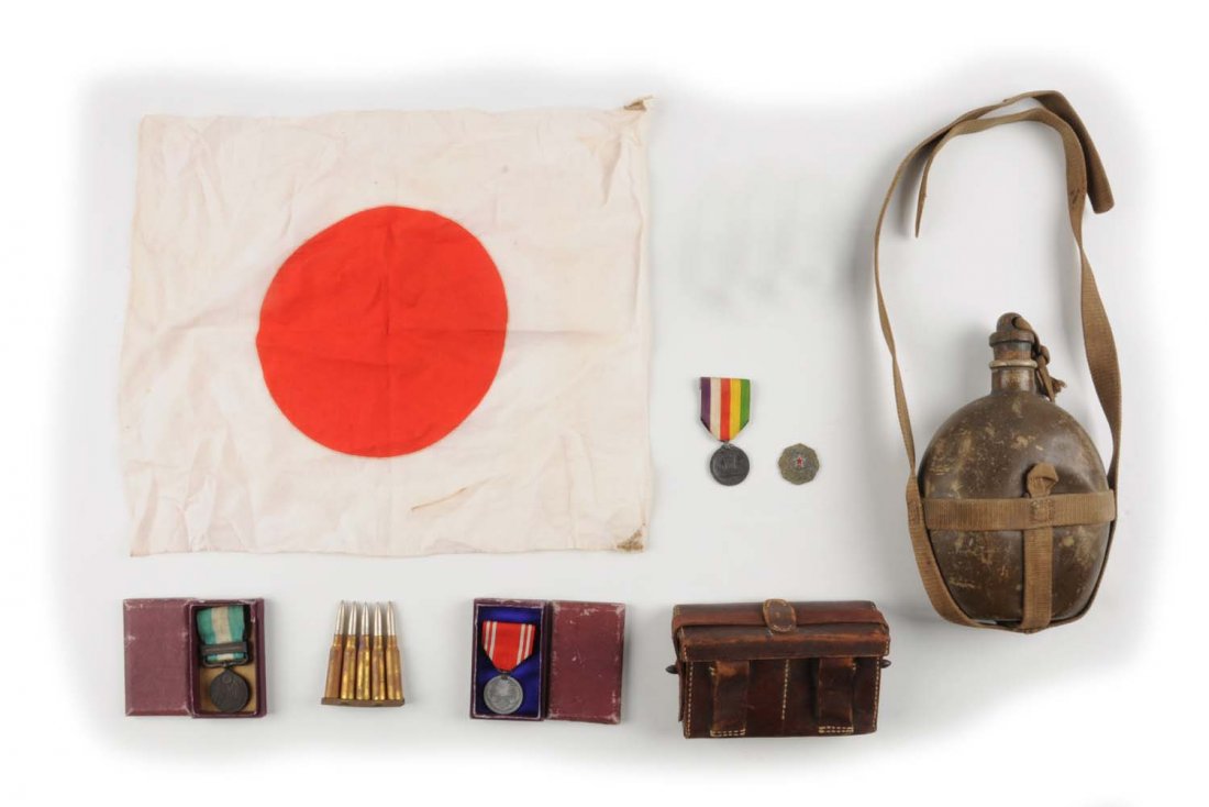 Lot of Japanese WWII Military items.: This lot includes a Type 97 grenade, a small personal flag, leather ammo pouch, a canteen, and four medals. Condition (Very Good Plus). Size 10"