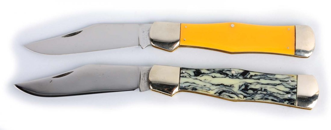 Lot of 2: Knives.: "OLCUT" Olean Cut Co., Olean, New York. 5 - 3/8" one-blade swell center folding hunter handled in yellow celluloid. Handles are perfect. Blade has been professionally cleaned to mint. Blade has full s