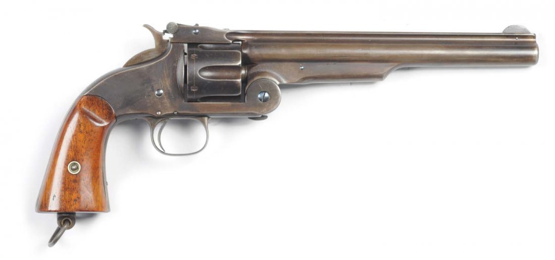S&W 2nd Model American Single Action Revolver.: Serial # 29232 Manufactured from 1872 to 1874. All metal surfaces are a pleasing mix of smooth blue-brown patina. Original grips are near mint. 8" barrel. There is an unusual lanyard ring in butt. Scr