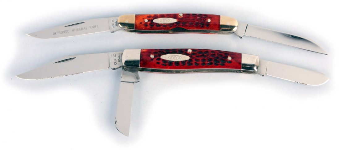 Lot of 2: Case Folding Knives.: Lot includes: a Case XX USA 3 - 7/8" "Hawbaker's Special" new improved "Muskrat" knife handled in red bone. Both blades are in full etch. Fine example! Circa 1970, and a Case XX USA 4 - 1/4" three-bla