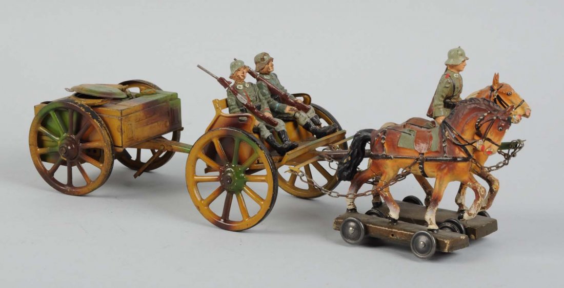 Lineol Tinplate Horse-Drawn Field Kitchen.: Depicts two horses pulling two soldiers in field wagon with separate piece in back. Composition and tin litho. Some chipping and wear. Some cracking to soldiers feet and guns. Condition (Very Good). S