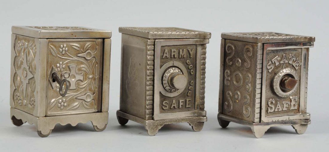 Lot Of 3: Cast Iron Safe Still Banks.: This lot includes an Army safe bank, a State safe bank, and another bank with a key lock. Condition (Very Good Plus). Size Each: 4" T.