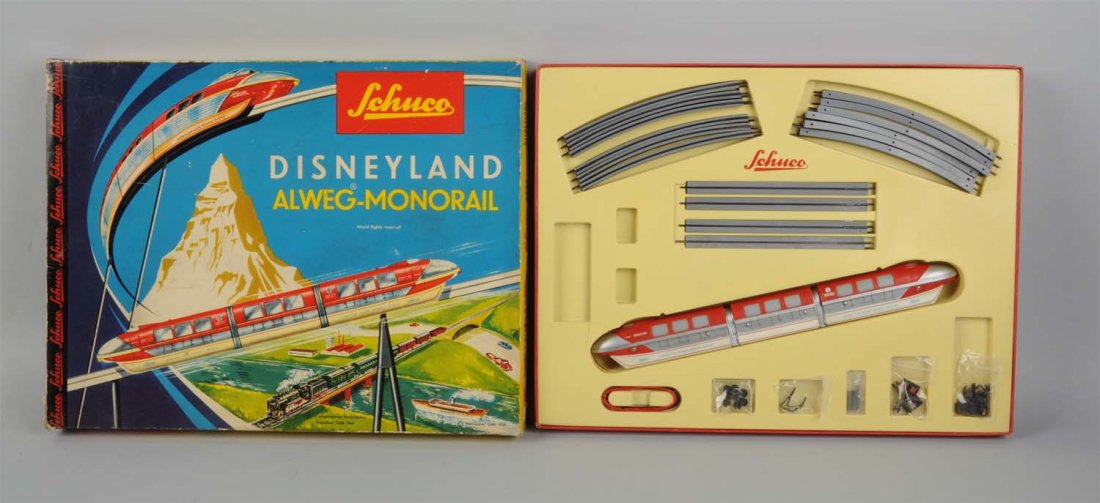 Disneyland Monorail With Original Box.: Made by Schuco in Western Germany. Monorail comes in three sections with two engines and a train car. It is made of tin and plastic. There are a couple of minor scratches towards the bottom of the tra