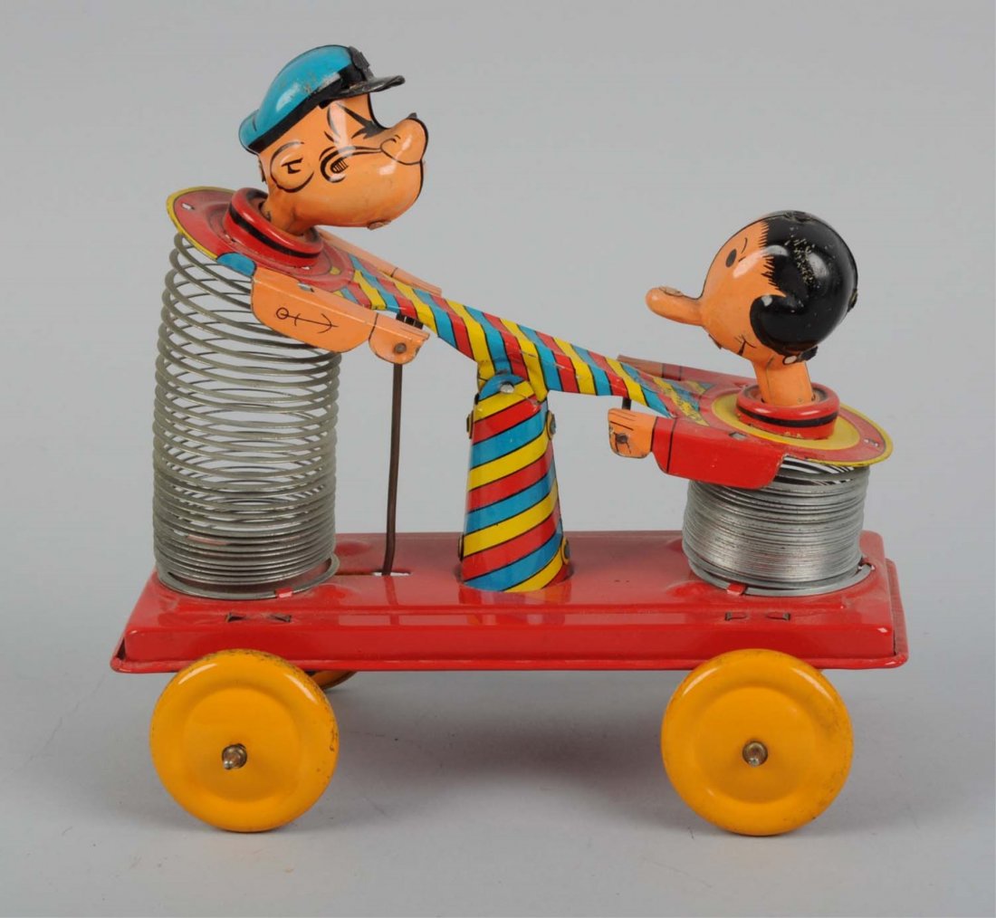 Tin Litho Popeye Slinky Hand Car: Made by Linemar in Japan. Tin litho sections of toy have a couple minor areas of scratches throughout. Bottom of the toy is very clean with no scratches or oxidation. Condition (Very Good - Excellent)