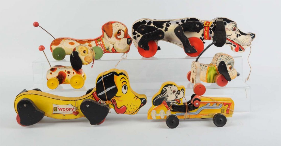 Lot Of 6: Fisher-Price Paper On Wood Dog Toys.: Including larger Snoopy, Woofy, and Fuzzy toys plus a small No. 7 dog in car and two other small Wagger toys. One missing tail, overall fairly complete. Various conditions. Condition (Very Good). Size