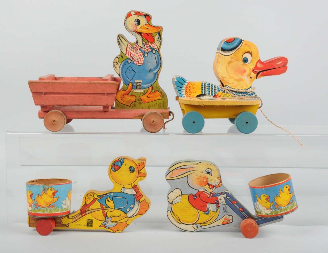 Lot of 4: Fisher-Price Easter Type Toys.: These paper on wood toys includes chicks and ducks, cart toy, one Gabby Duck toy, and two other small push cart toys. Some creasing and edge wear. Condition (Very Good). Size 7 - 1/2" L.
