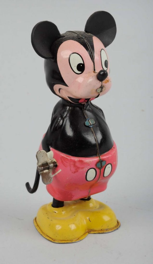 Disney Tin Litho Wind - Up Linemar Wirltail Toy.: This Walt Disney toy looks to have replacement rubber ears, toy has usual factory paint touch up on red marked "Linemar Walt Disney Productions" on rear. Some scratching and wear. Condition (Very Good
