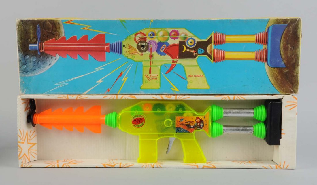 Plastic Apolo Gun.: Includes original box, has a couple of creases and small paper pulls. Most of the gun if plastic, which is see through so the gears are visible. Condition (Excellent - Near Mint). Size 24" L.