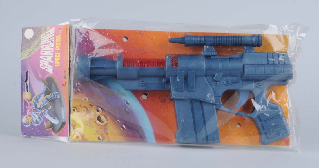 Sparkling Space Pistol in Box.: In original packaging. Gun is all plastic and in unopen and unplayed condition. Condition (Near Mint). Size 15" L.
