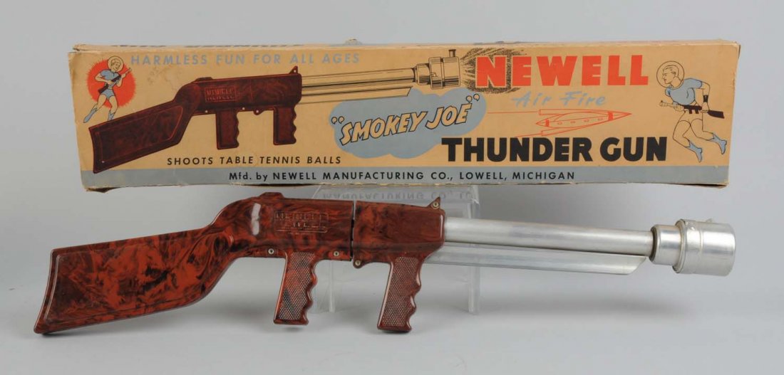 Aluminum & Plastic Air Fire Thunder Gun & Box.: Made by Newell Manufacturing Company in the USA. There are very slight scratches to the plastic and aluminum that are barely visible. Includes the original box which has some paper creases and wear ar