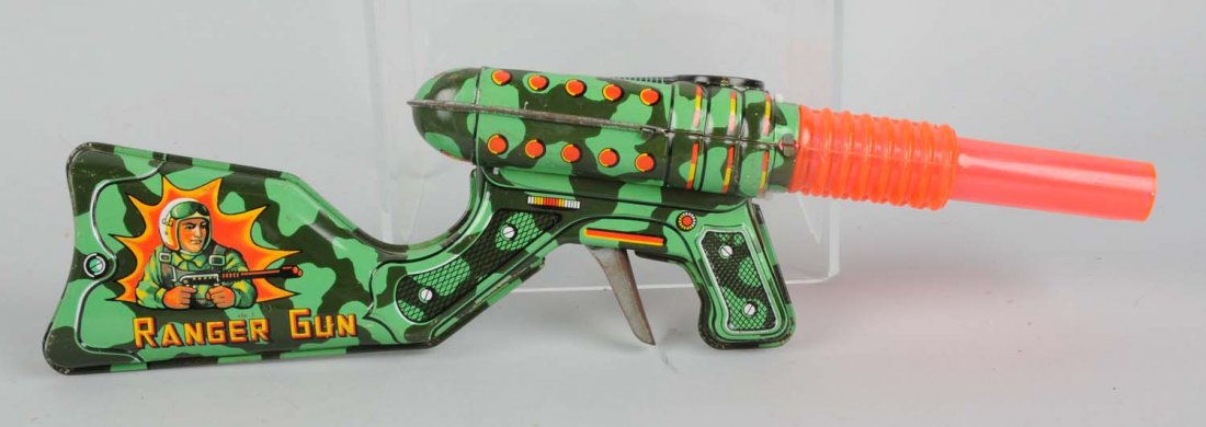 Tin & Plastic Double Barrel Space Gun.: Made by KO Japan. There are some scratches and slight oxidation to the tin section of the gun. Gun reads "Ranger Gun" on both sides. There is a transparent plastic section of the gun behind the barrel