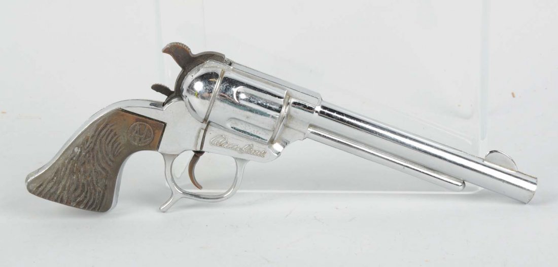 Scarce Alan Ladd Cap Gun.: Embosses Alan Ladd on both sides. Made of cast metal, original grips, well used. Condition (Very Good). Size 10" L.