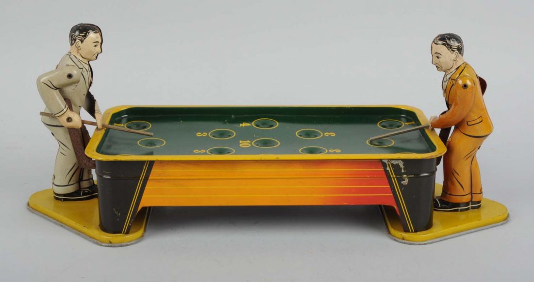 Tin Wind - Up Billiard Toy.: The toy has some scratches throughout the toy. Includes original key, and tin players with pool sticks. Toy is missing its pull balls and doesn't have original box. Players do have scratches throughou