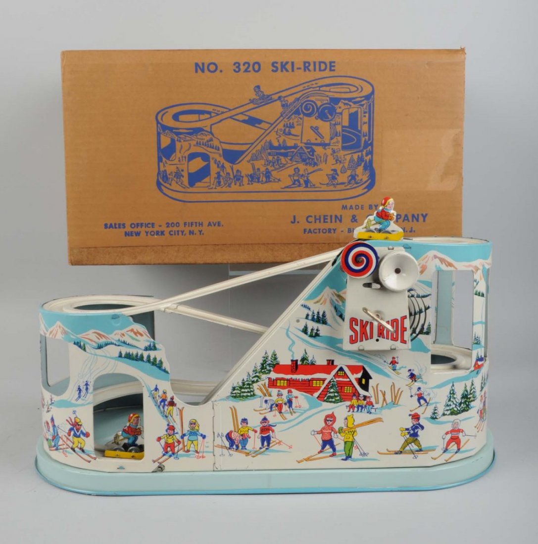 Tin Litho Wind-Up Ski Ride Roller Coaster In Box.: Made by J. Chein in the USA. No. 320 version of the Ski-Ride toy. Roller coaster has small spots and scratches, mainly to the upper section of the ski slope. Otherwise the entire toy is very clean. In