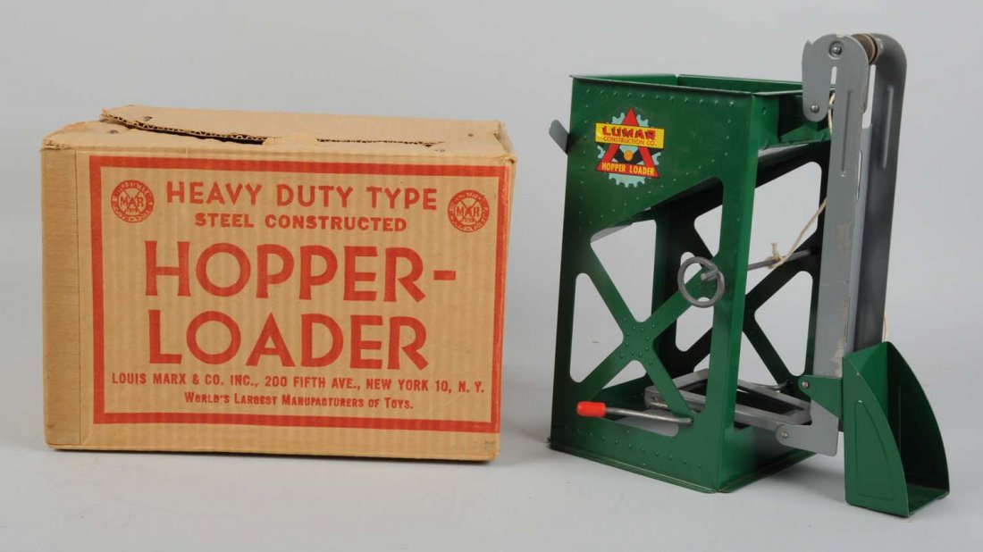 Pressed Steel Hopper Loader With Original Box.: Made by Marx in the USA. Hopper loader has some small spots of paint scratches to the loading part. Has two levers for loading and unloading. Includes the original box that has some tears and wear. Co