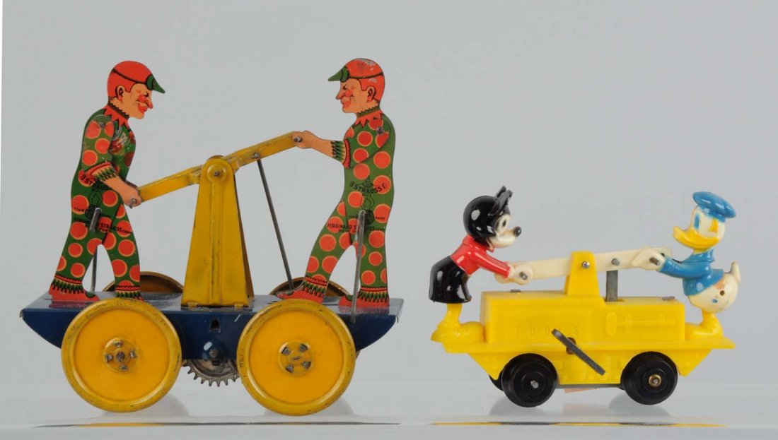Lot Of 2 : Wind - Up Tin Hand Cars Toys.: The first one is a Marx plastic car of Mickey and Donald Duck, the second one is made by Ferdinand Strauss which is a tin litho hand car. The Marx car has some scratches to the plastic figures of Mick
