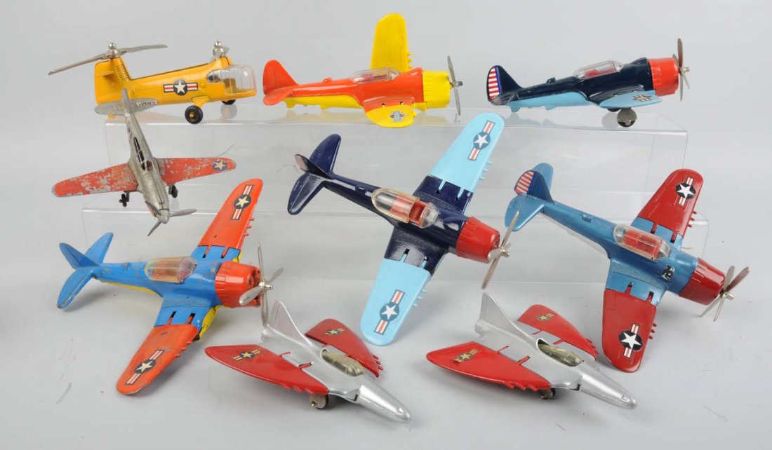 Lot of 9: Diecast Small Planes.: Made by Hubley in the USA. There are six single propeller planes, one helicopter, and two small jets. All have some varying degrees of scratches and loss to the paint. All are embossed "Hubley Kiddie 