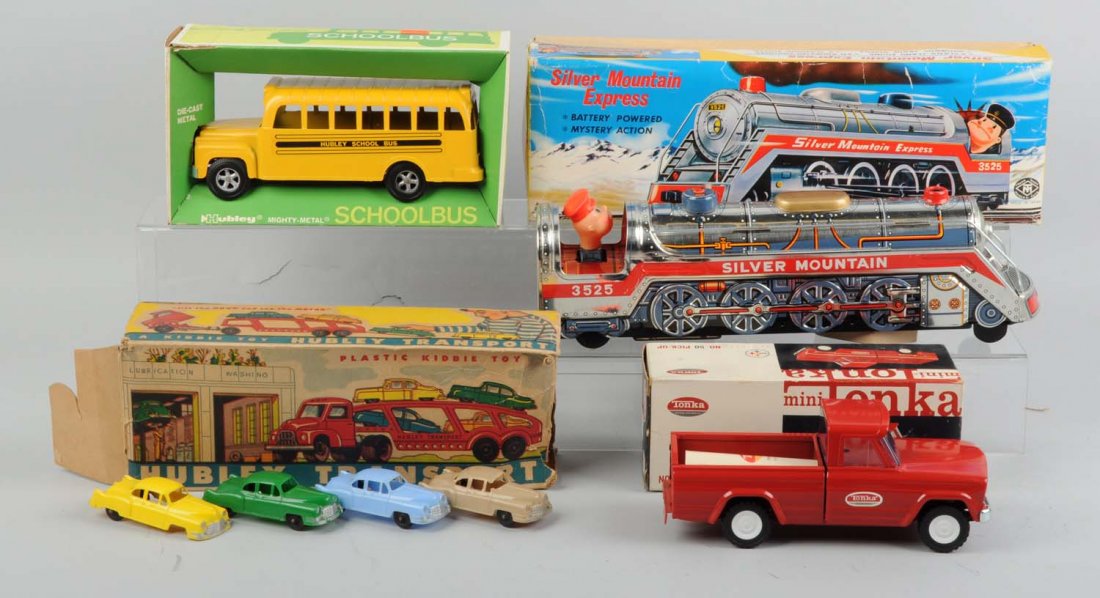 Lot of 8: Assorted Vehicles In Original Boxes.: Makers include Hubley and Tonka from the USA, and Modern Toys in Japan. Includes a Hubley school bus, a mini Tonka No. 50 pick-up truck, a Modern Toys Silver Mountain Express train, and four Hubley tr