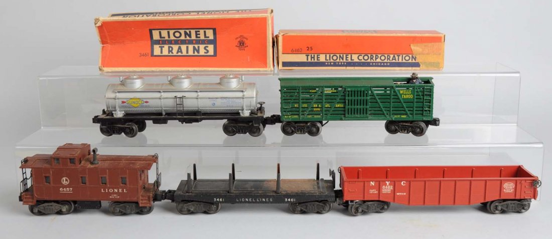 Lot of 5: Lionel Post - War Rolling Stock.: Lot includes: 6415 three dome Sunoco tank car, complete and all original, has some scratching but very good condition. 3370 Wells Fargo sheriff and outlaw car, complete and original but has some paint