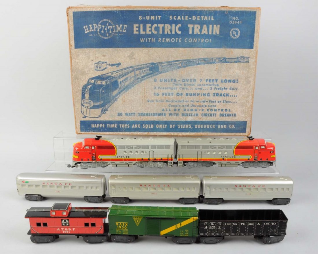 Marx 05944 Happy Time Train Set in Original Box.: Lot includes: No. 21 tin litho diesel Santa Fe, complete. No. 21 Santa Fe Dummy Unit, complete. No. 3152 Santa Fe passenger coach, all original. No. 2152 Santa Fe passenger car, like new condition. No