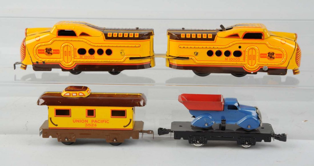 Marx M10005 W/U Yellow Brown UP 6" Flat w/ Truck.: Lot consists of Marx 10005 wind-up powered A unit that does not have a key, otherwise complete and all original, even has dog bone coupler. Also, M10005 Dummy A unit, complete and all original, very c