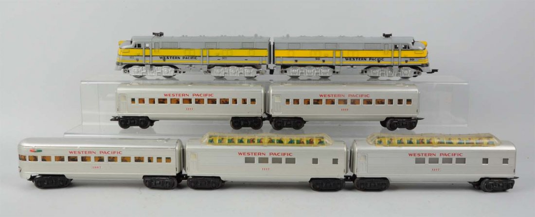 Marx 901 W. P. Grey & Yellow Diesels & W. P. Pass: Lot includes: No. 901 powered diesel; complete and all original. Dummy A - unit; missing one ornamental horn otherwise complete and all original. Two No. 1217 full dome passenger car; needs to be re-w