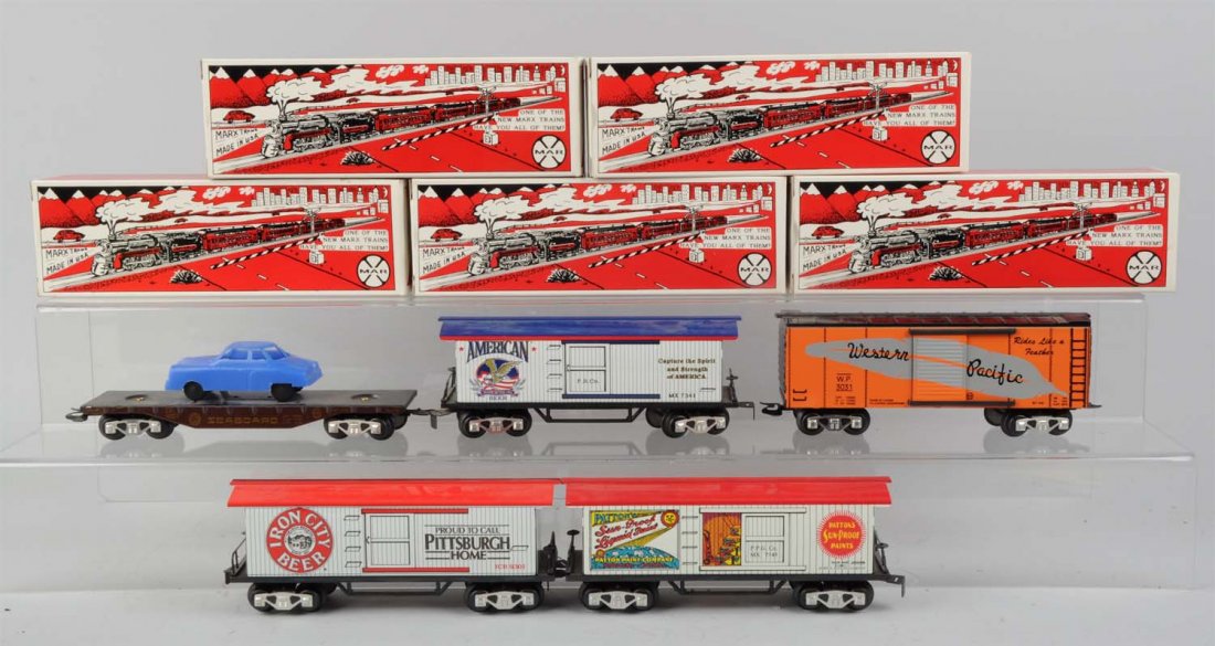 Lot of 5: Assorted Marx Freight Cars.: Lot includes: No. 7342 Western Pacific box car. No. 2344 Seaboard and PRR flat car. No. 7341 American Beer reefer. No. 7345 Patton Paint box car. No. 7334 Iron City beer reefer. All cars are complete 