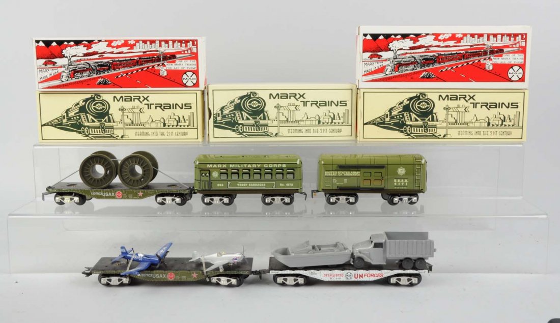 Lot of 5: Marx Modern Military Cars.: Lot includes: No 4171 6" box car. No. 7312 Scale military flat car with airplanes. No. 4172 barracks car. No. 73331 UN flat car. No. 7384 US Army flat car. All cars are complete with box. Condition (E