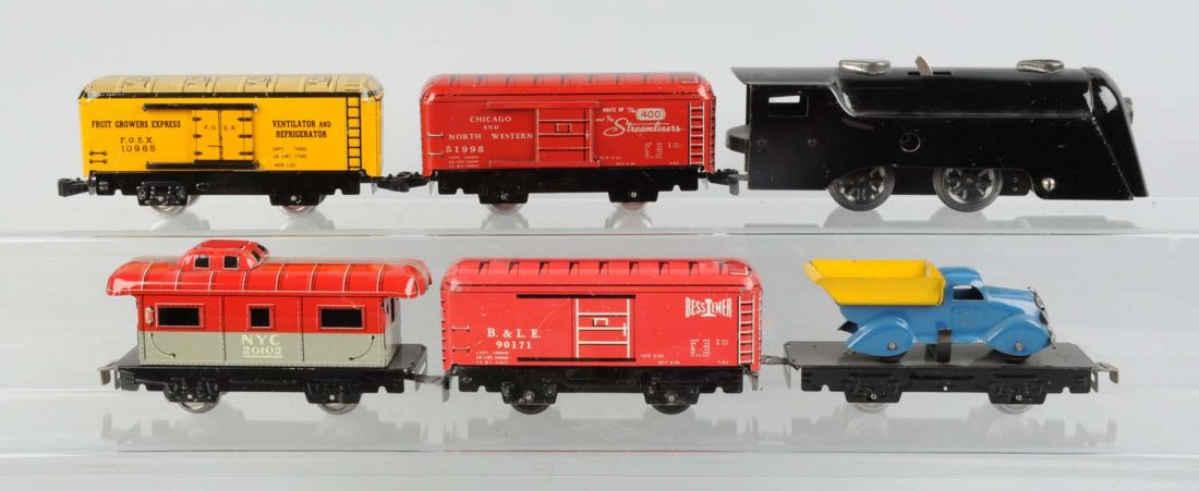 Marx Commodore Vanderbilt with 5 Freight Cars.: Includes: Wind - up steam locomotive, missing key, complete and all original. One six inch flat with Marx blue and yellow dump truck, this car is complete and all original. No. 171 B & LE box car red,