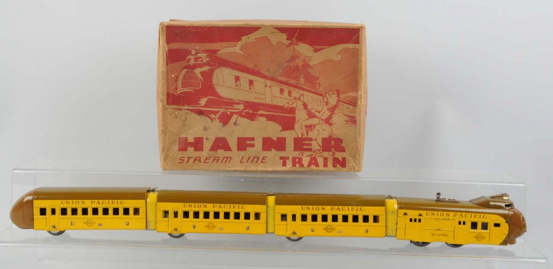 Hafner Wind - Up Streamline Train Set In Box.: Includes: M10000 Union Pacific Streamliner; Wind - Up mechanism does work. Has battery - operated headlight; Has some scratches and paint chips but mostly on vestibule. First coach is all complete and