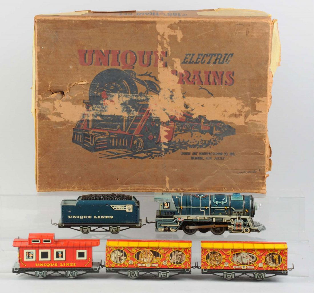 Unique Boxed Train Set with Circus Cars.: Set consists of one electrically operated steam locomotive that is complete and all original; a tender that is complete with some scratches; Jewel T circus car has an elephant, tiger, and a giraffe an