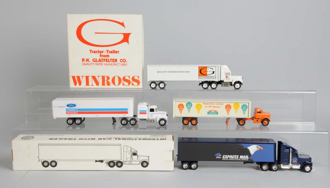 Winross & Ertl Tractor Trailers.: One older Winross Howard Johnson's tractor trailer is complete and excellent. Winross Glatfelters Company tractor trailer mint in original box. Ertl Ford tractor trailer complete and excellent. Ertl e