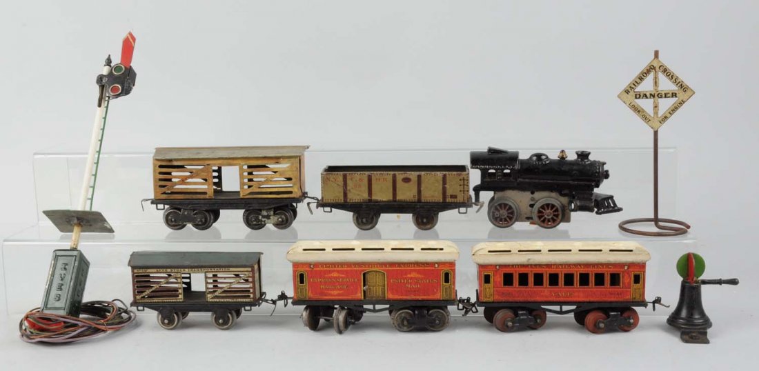 Interesting Assortment of Mainly Ives Toy Trains.: Lot includes: earlier Ives No. 55 four - wheel cattle car, missing couplers but otherwise complete and all original, paint chips mainly on roof, very good condition. No. 65 Ives Livestock car, car nee