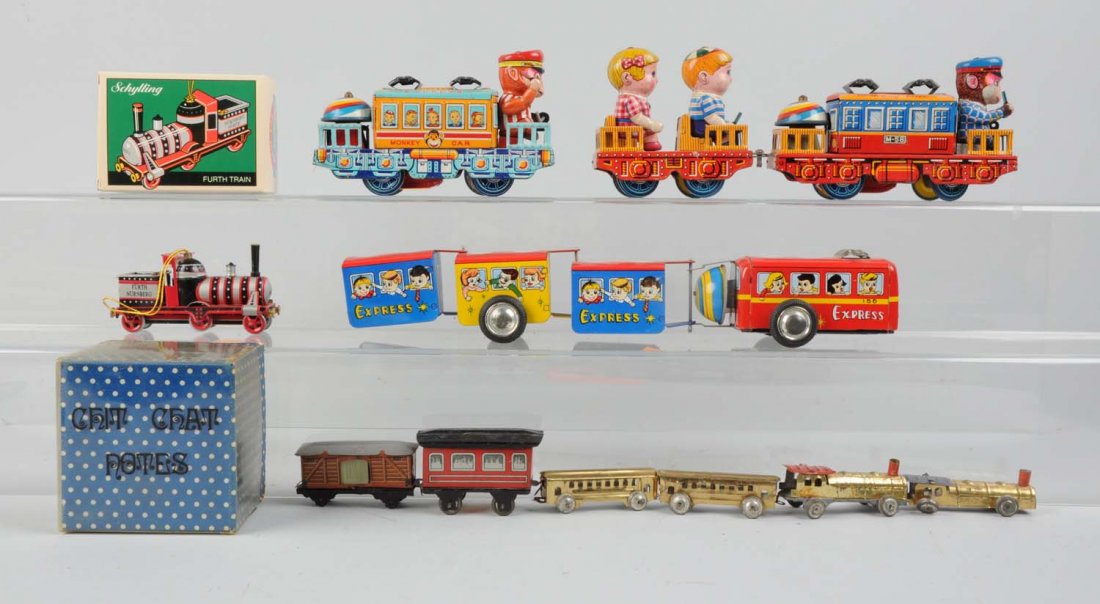 Lot of 5: Wind - Up Toy Trains.: Includes: One called the Monkey Train, in working condition, appears to be complete and in excellent condition. One called Monkey Car Express, very clean and attractive and in excellent condition. The
