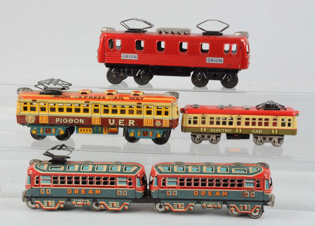 Lot of 4: Japanese Tin Toy Trains.: Lot consists of: A Union Express Railway Pigeon car, No makers mark. Appears to be all original and complete. A two piece Dream train set, friction, complete and all original, marked M in a triangle,