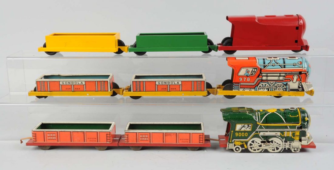 Lot of 9: Courtland Toy Trains.: Consists of No. 9000 steam locomotive, broken wind - up mechanism, has some scratches. A No. 978 wind - up steam locomotive, wind - up mechanism is broken but clean litho. A red push toy locomotive. T