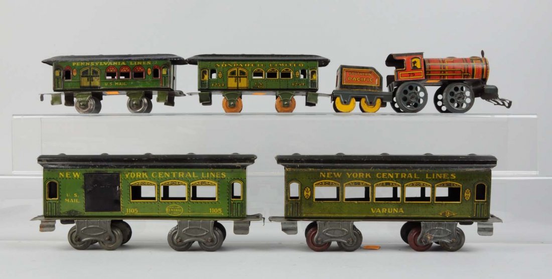 Lot of 5: Nonpareil Toy Train Cars.: Nonpareil Southern Pacific steam locomotive and tender, has some rust on the ca roof and some on the wheels, scratches and paint chips throughout but good condition. Nonpareil PRR combo car, four whee