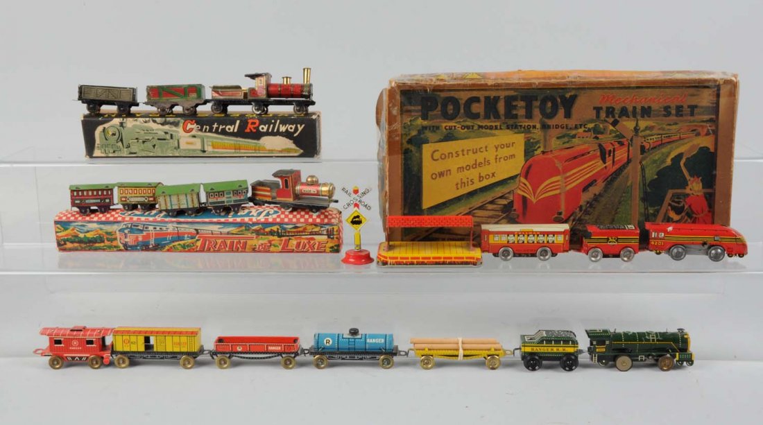 Lot of 3: Japanese Tin Toy Trains.: Includes original boxes. Lot consist of one central railway express train, makers mark is an Indian head, trademarked Japan, much like a penny toy. The locomotive has paint chips and scratches through