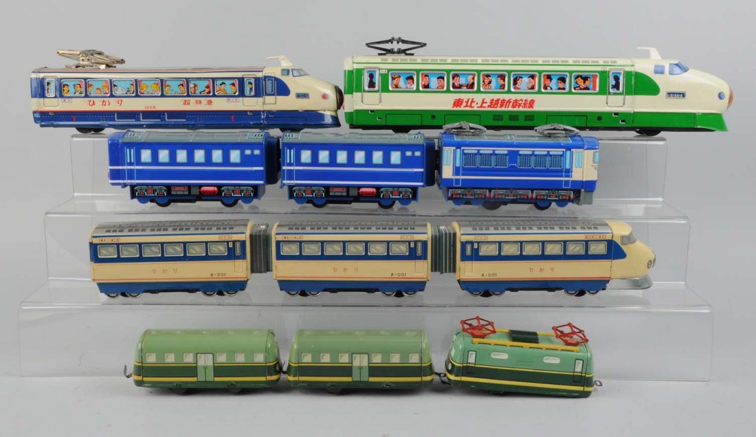 Lot of 6: Toy Trains.: Includes: One three piece Daiya made in Japan stream line, excellent condition. One Chinese bullet train Ichiko made in Japan, excellent condition. One M in a circle made in Japan, complete and in exc