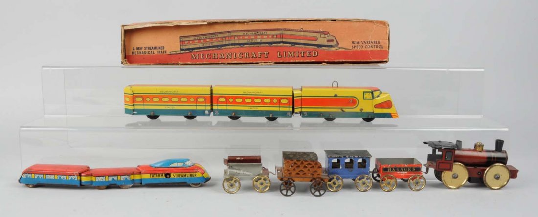 Lot of 7: Assorted Toy Trains.: Includes: one Mechanicraft limited wind - up locomotive streamline, complete and in excellent condition has original box. Futurmatic streamline, complete and all original but has some scratches, very 