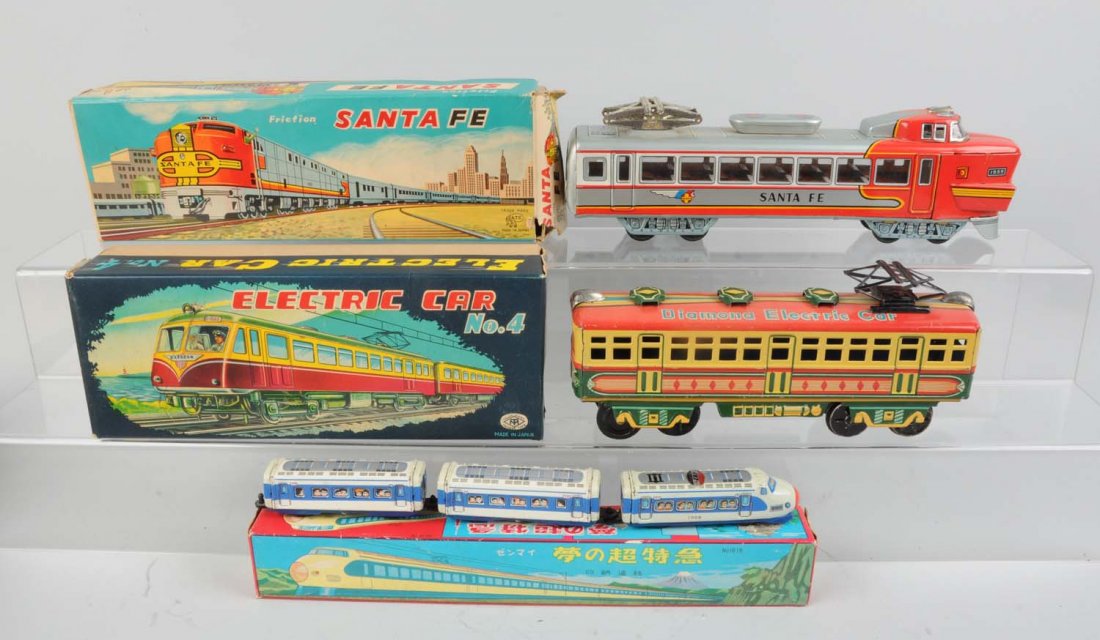 Lot of 3: Japanese Tin Litho Toy Trains.: Lot includes an ATC Santa Fe friction locomotive, complete and all original, clean and very attractive, original box has some tears. TM Diamona electric train car, friction drive, complete and all ori
