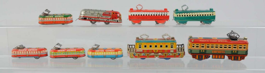 Lot of 9: Japanese Tin Toy Trains.: Includes: Tin litho Pacific Coast Special Express, friction drive, complete and all original, excellent condition. Pacific Railway locomotive, friction drive, complete and in excellent condition. Four