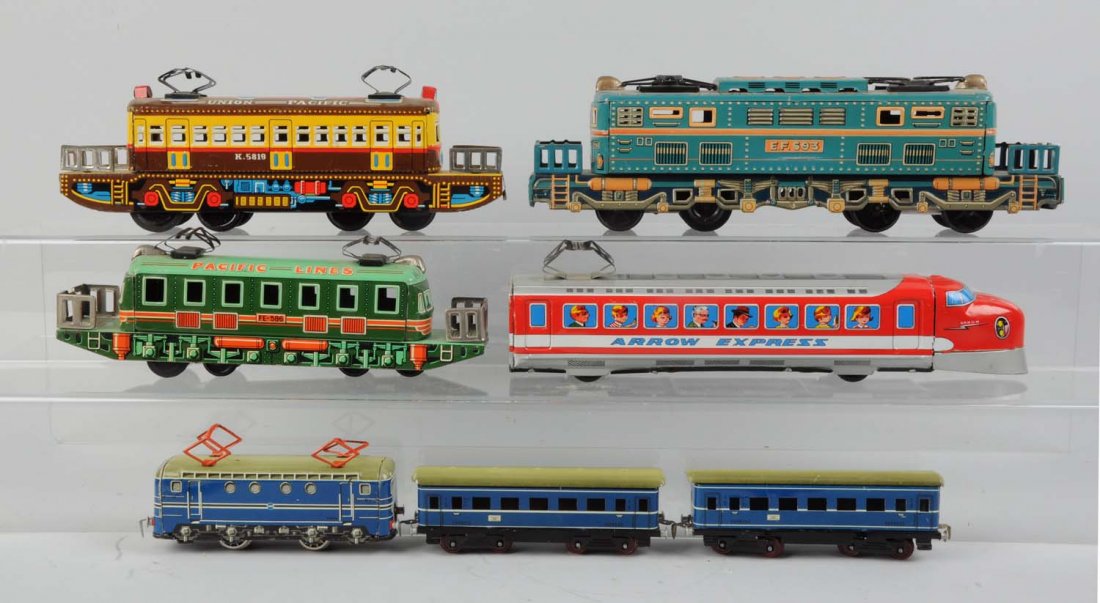 Lot of 7: Assorted Japanese Tin Litho Toy Trains.: Includes: One Special Express Line, complete and all original, clean and attractive, friction drive, excellent condition. One Union Pacific locomotive, complete and in excellent condition. A Pacific L