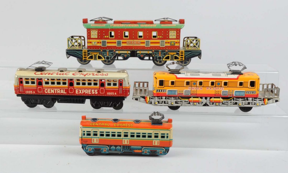 Lot of 4: Japanese Tin Litho Toy Trains.: Includes: Pennsylvania Railway, trade mark Y in a leaf design, made in Japan, complete and all original, very clean and attractive, excellent condition. Central Express friction locomotive marked AN i