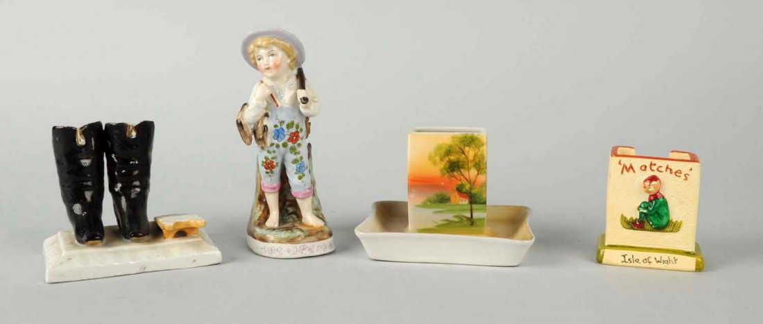 Lot of 4: Ceramic Match Holder with Strikers.: Lot includes depictions of: hippos; boots; Isle of Wight; and a boy with rabbits. With match box lids. Condition (Excellent). Size Largest: 5 - 1/2" T.