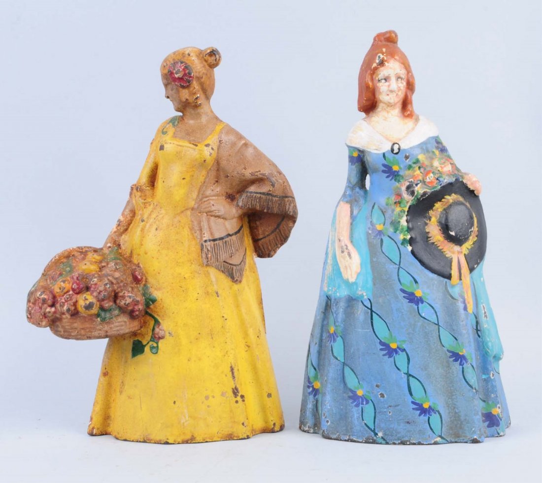 Lot Of 2: Cast Iron Women Doorstops.: Includes – Senorita , #26, and Lady w/ Hat, #41. Condition (Good-Very Good). Size Largest: 11 - 1/2" L.