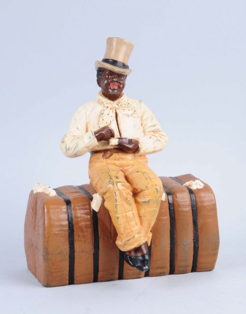 Cast Iron Man on Bale of Cotton Doorstop.: Figure is pot metal and bale of cotton is cast iron. Judd Co, “1248”. Repainted. Condition (Very Good). Size 8 - 1/2" L.