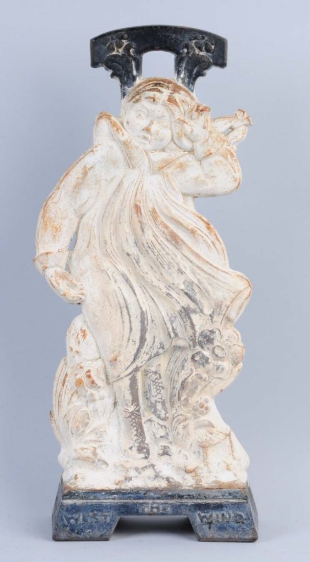Cast Iron West Wind Doorstop.: Made by Judd Co. Marked on base, “The West Wind”. Repainted. Rare. Condition (Good). Size 18" T.