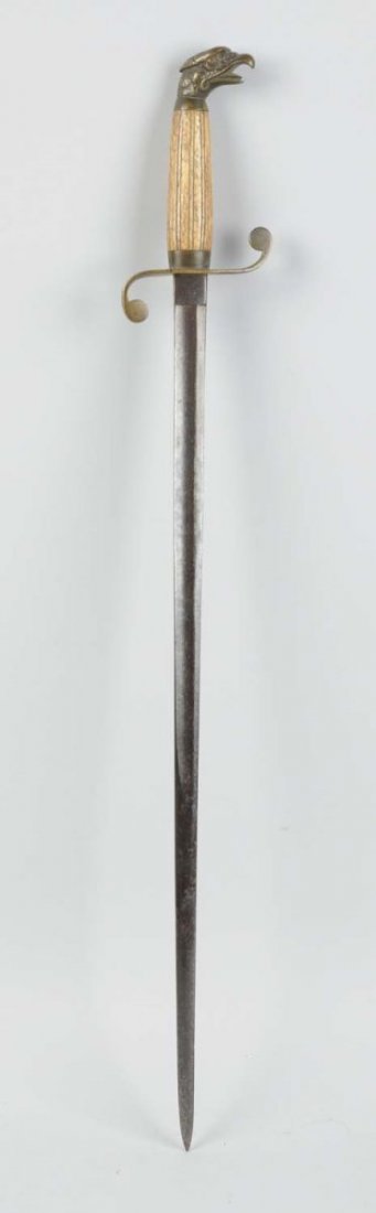 Sword With Eagle Handle.: This sword has a bone handle with a brass eagle head. Condition (Very Good). Size 25" L.