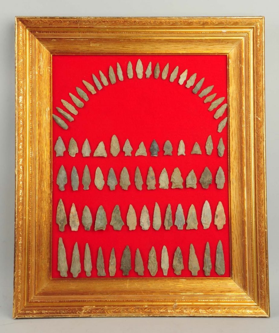 Lot of Assorted Arrowheads.: Typical Pennsylvania Chert and rhyolite. Gold colored wood frame containing 76 field grade arrowheads. Size 26" x 20" W.